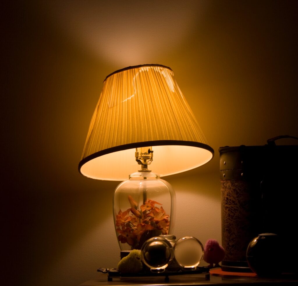 brown and clear glass table lamp